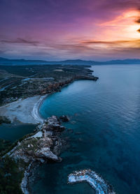 High angle view of sea shore against sky during sunset