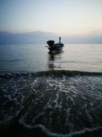 Boat in sea against clear sky