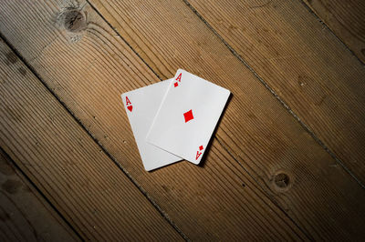 Close-up of red cards on table