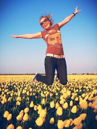 Woman jumping in sky