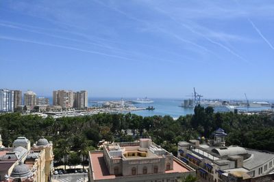 High angle view of buildings against clear blue sky