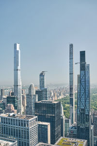 Modern buildings in city against clear sky
