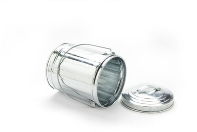 Close-up of glass jar against white background