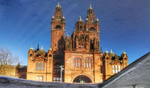 Low angle view of church against blue sky