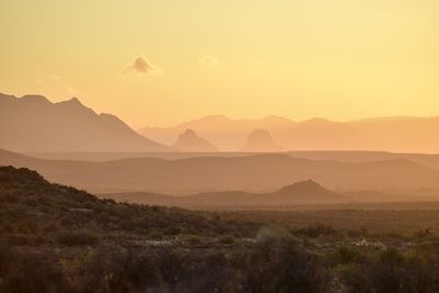 Scenic view of mountains against sky during sunset