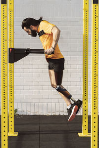 Paralympic athlete exercising on gymnastics bar