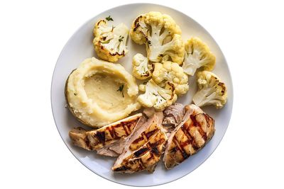 Directly above shot of food in plate on white background