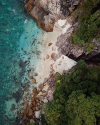 Directly above shot of rocks in sea