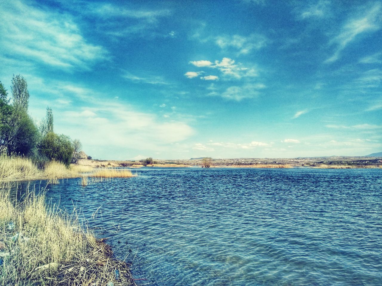 sky, scenics, water, beauty in nature, tranquility, nature, tranquil scene, cloud - sky, no people, outdoors, day, lake, landscape, tree