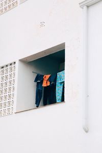 Clothes hanging on wall of building