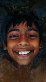 Directly above portrait of smiling boy