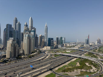 Modern buildings in city against clear sky