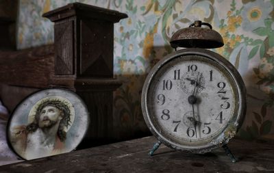 Close-up of clock on table