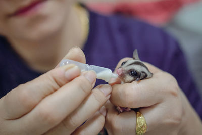 Midsection of woman holding hands