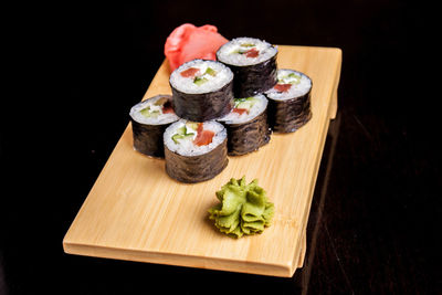 Close-up of sushi served on cutting board