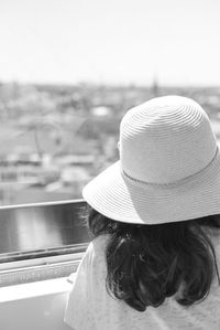 Rear view of woman wearing hat