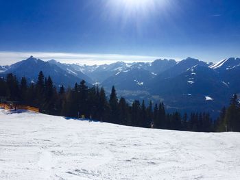 Scenic view of snow covered mountains