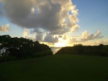 Scenic view of field against sky during sunset