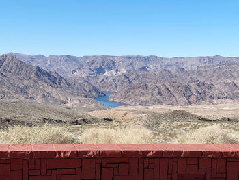 Scenic view of snowcapped mountains against clear blue sky