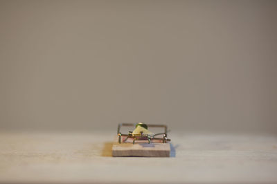 Close-up of telephone booth on table against white background