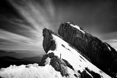 Scenic view of snow covered mountain against sky