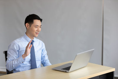 Man using laptop on table