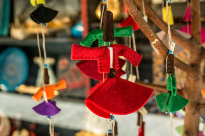 Close-up of multi colored decorations hanging at market stall