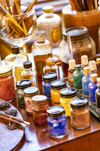 High angle view of bottles on table at market stall