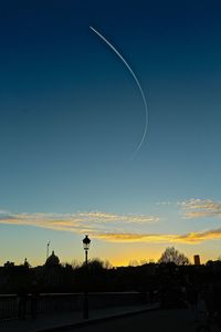 Silhouette trees against sky during sunset