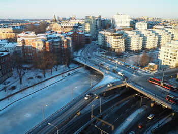 High angle view of city street and buildings against sky