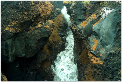 Waves splashing on rocks