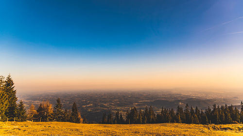 Scenic view of landscape against sky during sunset