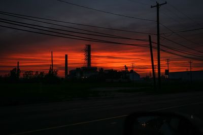 Railroad tracks against sky during sunset