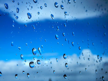 Full frame shot of wet glass window