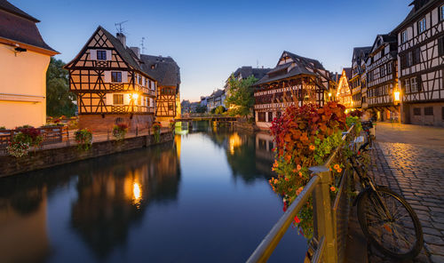 Canal amidst buildings in city