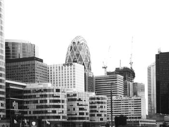 Modern buildings in city against sky