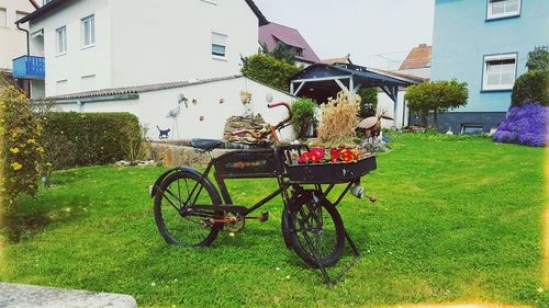 Bicycles parked on lawn outside house