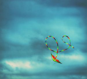 Low angle view of multi colored kite against sky