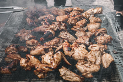 High angle view of meat on barbecue grill