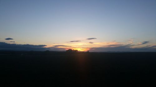 Scenic view of silhouette landscape against sky during sunset