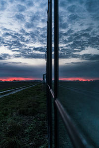 Scenic view of field against sky during sunset