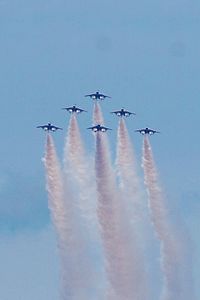 Low angle view of airplane flying in sky