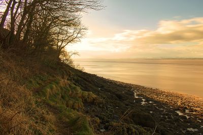 Scenic view of sea against sky at sunset