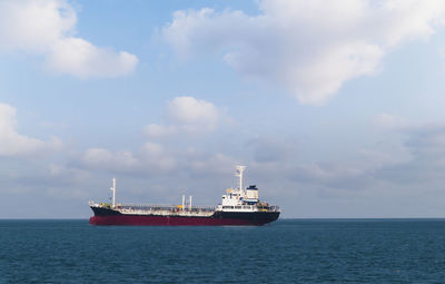 Ship in sea against sky