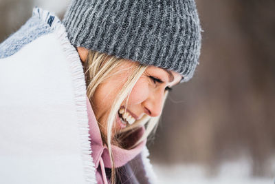 Close-up portrait of woman wearing hat