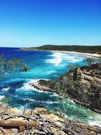 Scenic view of sea against clear blue sky