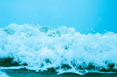 Close-up of wave splashing on shore