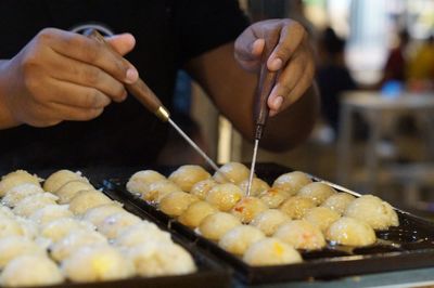 Close-up of person preparing food