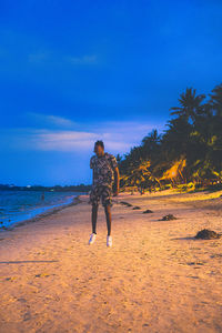 Full length of man jumping on beach