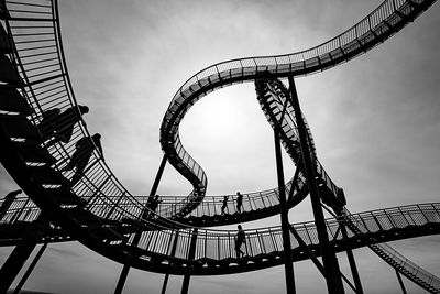 Low angle view of rollercoaster against sky